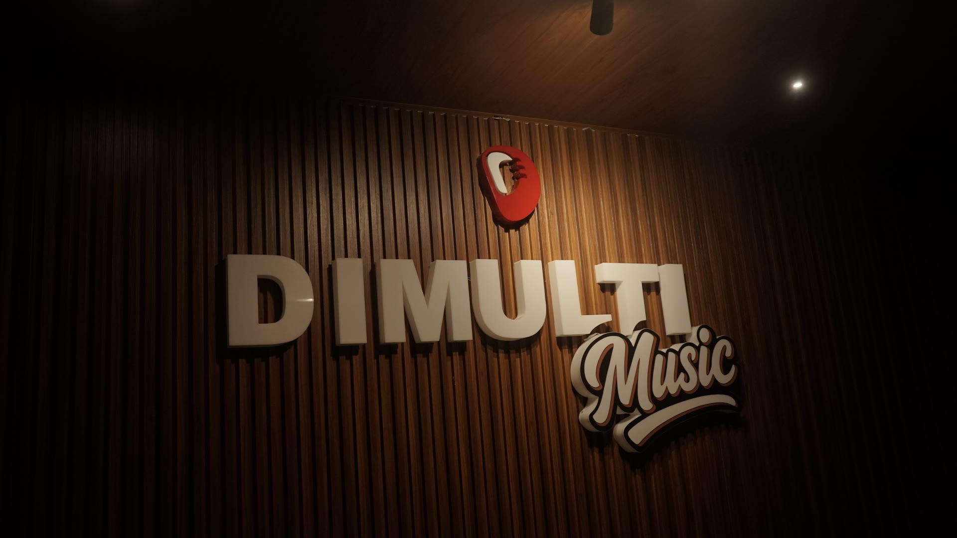 DIMULTI Music logo wall at the studio where philosophical company music is composed